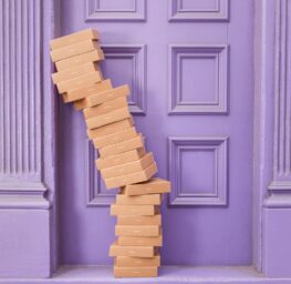 name fpseloxfeu4 b4569a7a ac62 42a7 a4d5 abedeba4297c.jpg pile of brown boxes beside purple wooden wall